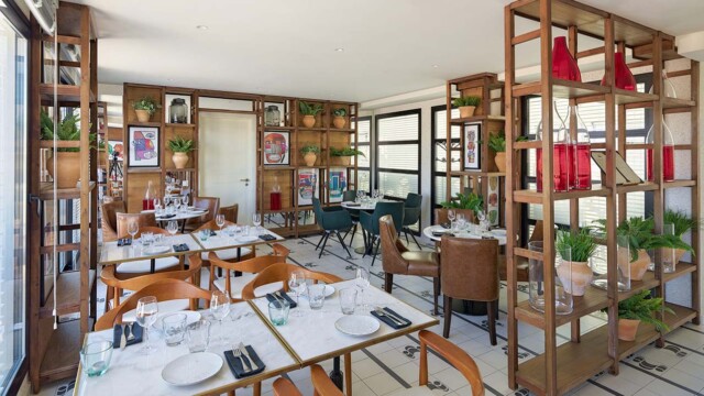 This is a lovely spot for an intimate dinner at night as well. Courtesy image H10 Cubik Hotel Barcelona Tapas Bar Atik (Rooftop Level)