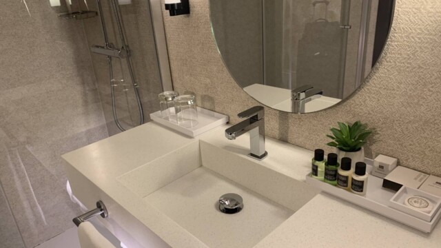Hotel Molina Lario Guest Room Sink and Shower