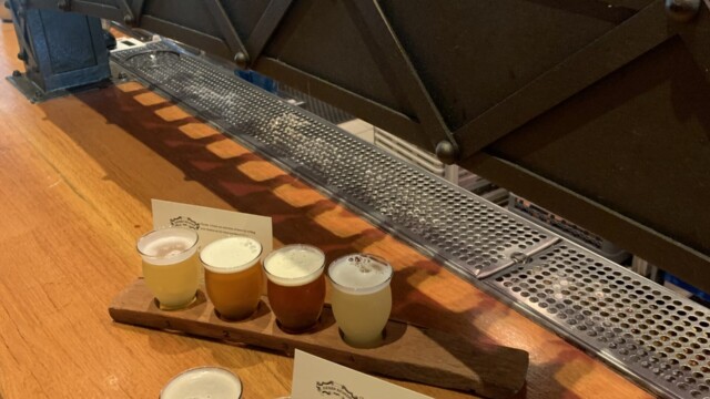 Sierra Nevada Brewing Mills River Taproom Inside with a Flight in Ashville, NC. © 2023 Rob Hard Sierra Nevada Brewing Mills River Taproom Inside with a Flight in Ashville, NC